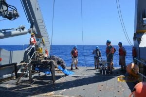 scientists on the research vessel Atlantic Explorer deploy pumps off the stern